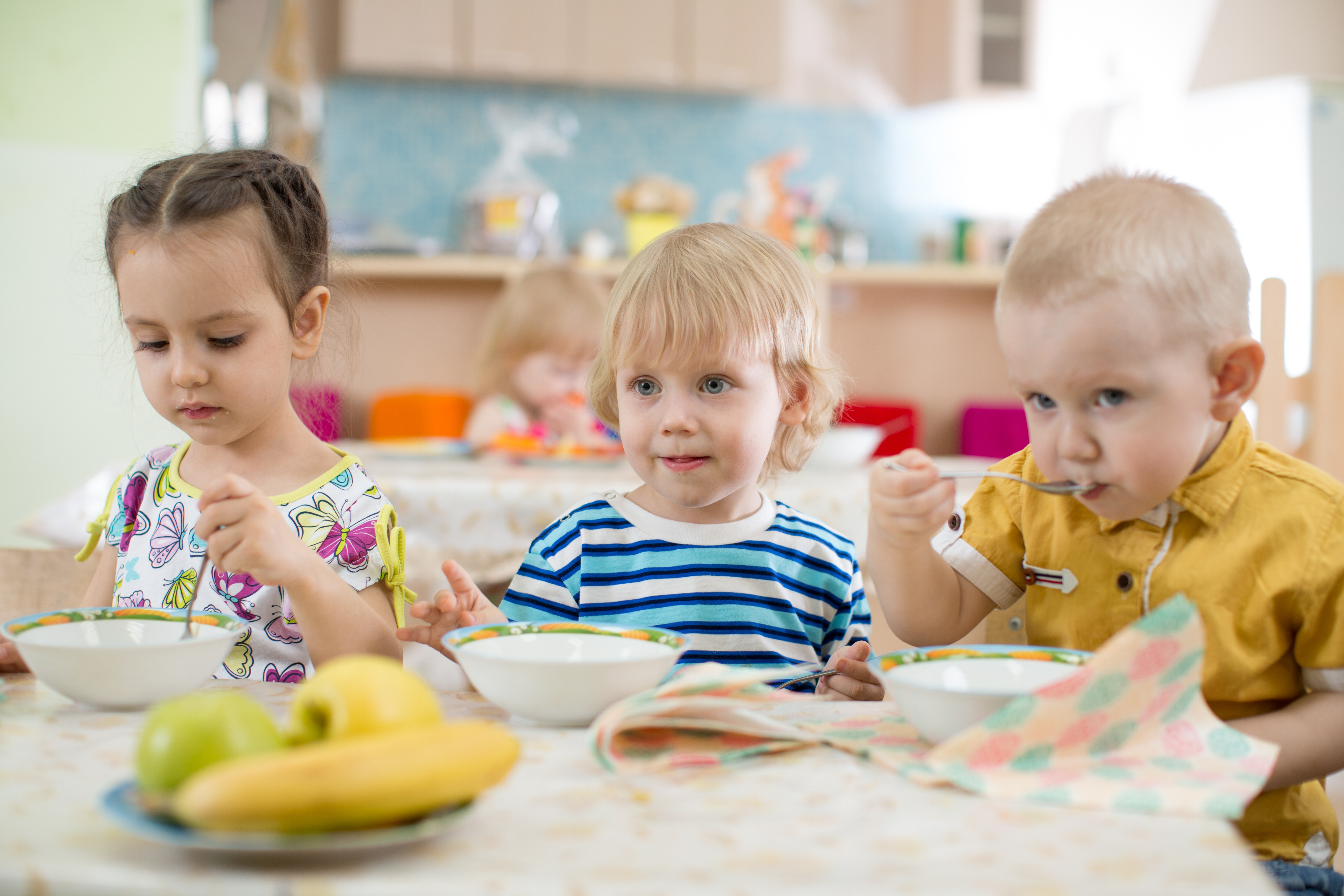 Kids eating in kindergarten or day care centre