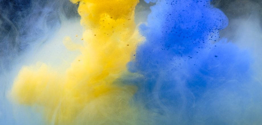 Fluid art. Abstract background. Yellow-blue flow on black. Fluid art. Abstract background. Yellow-blue flow on black.