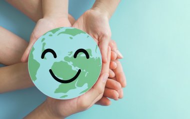 Hands holding earth with smile face, save planet, earth day, env